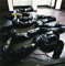 untitled   天然ゴム・衣類・バイブレーター１０台・タイマーで作動 20×20×2588（cm） 和敬塾の屋根裏部屋での展示風景  1998